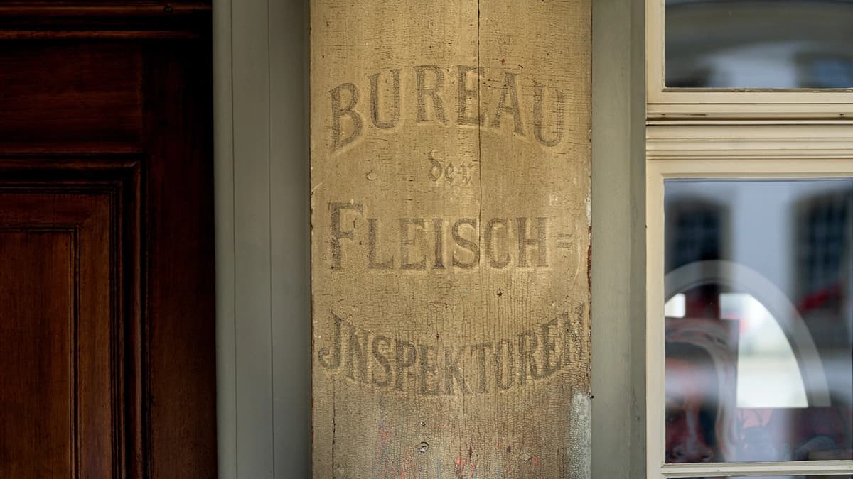 Historic sign “Bureau of Meat Inspectors” in Bern's old town.