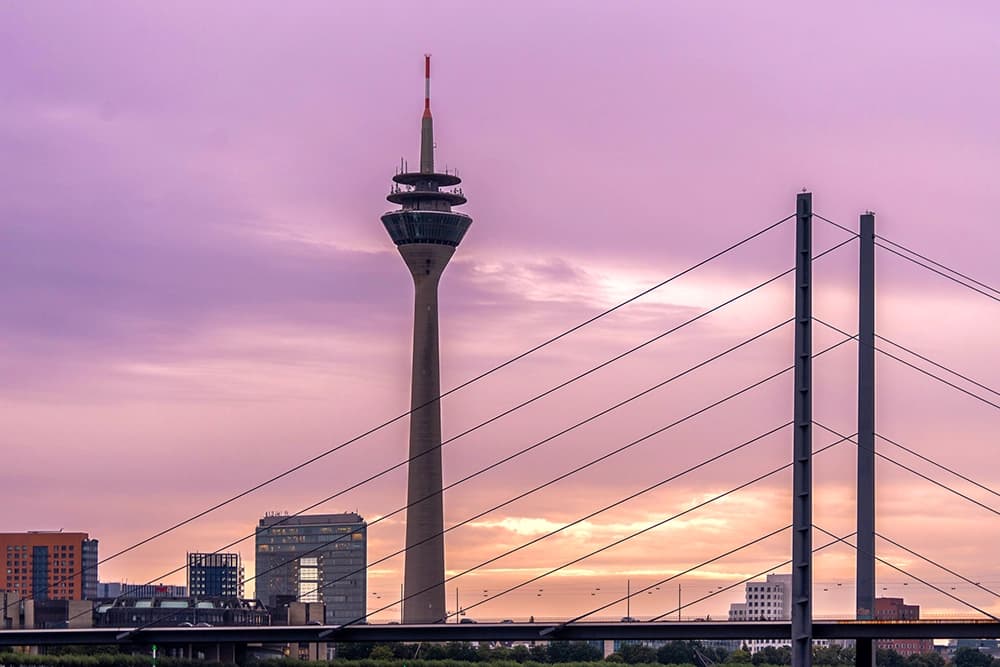The Düsseldorf skyline with the bridge and the television tower in the evening.